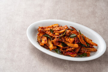 Terong goreng or fried eggplant with dried shrimps and sambal.