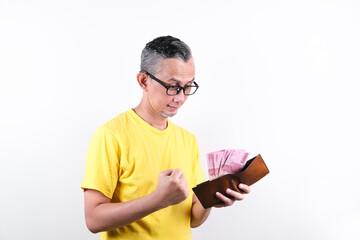 Portrait of Adult Asian Man opening wallet and taking out money, happy face
