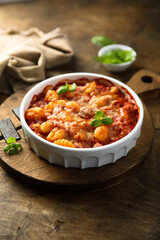 Baked potato gnocchi with tomato sauce and basil