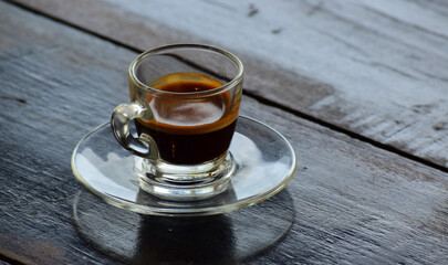 Coffee is a cup of coffee placed on the floor.