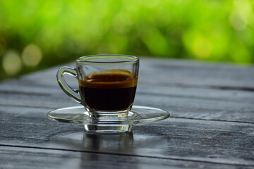 Coffee is a cup of coffee placed on the floor.