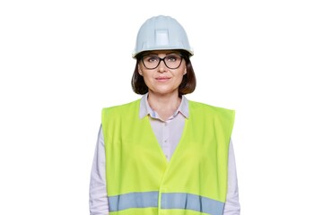 Portrait of female industrial worker in protective helmet vest on white background