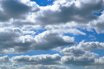 Beautiful white cumulus clouds in the blue sky