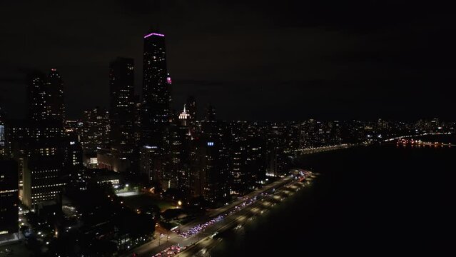 Fixed Aerial View of Lake Shore Drive at Night. Hancock Building Lit Up