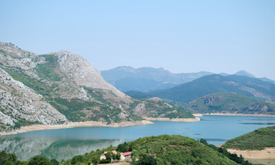 View of the Riaño reservoir and surrounding mountain range, León, Spain. - Powered by Adobe