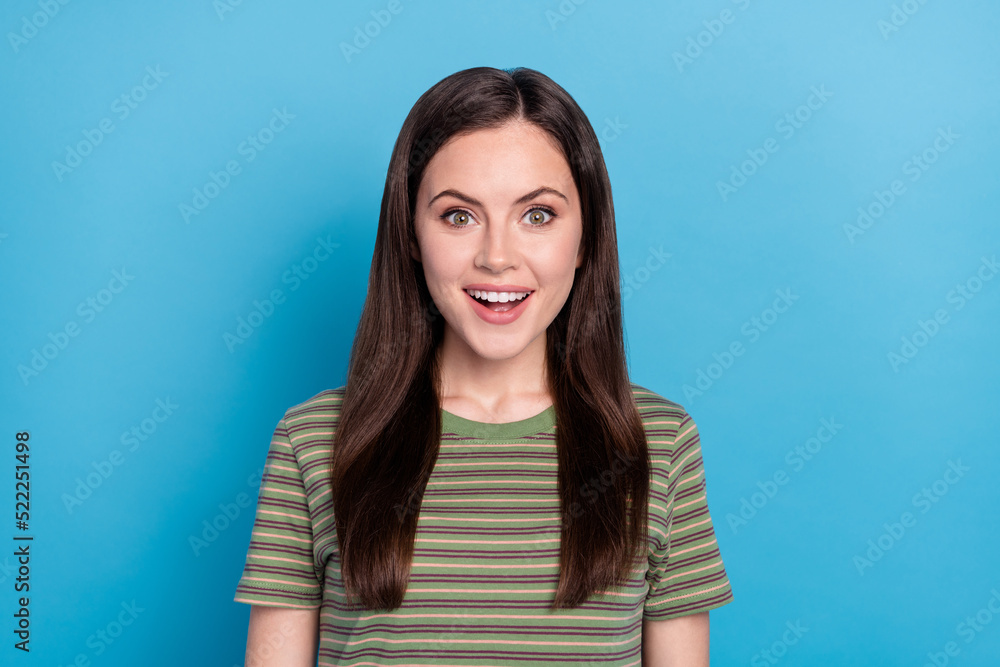 Sticker photo of impressed young brunette lady wear green t-shirt isolated on blue color background