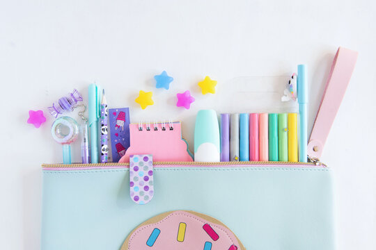 Flat lay composition with different colorful school stationery on white background. Back to school.