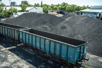 empty railway wagon for transportation of coal and coal halide in sunny day - obrazy, fototapety, plakaty