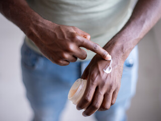 Close-up�of person applying moisturizer on hand