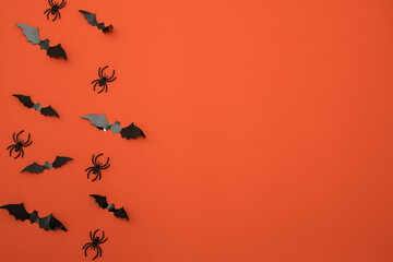 happy halloween on orange background. Holiday concept, place for text, top view, bats