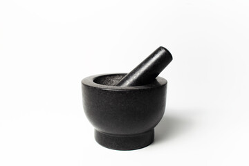 Close-up of granite stone grinder bowl of black, on white background.