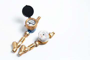 Close-up of two water meters for hot and cold water isolated on white studio background.
