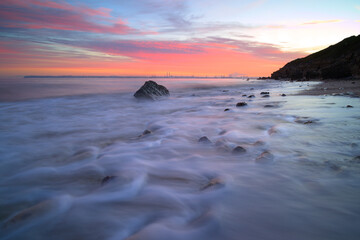 Long exposure, Villerville beach facing Le Havre illuminated at sunrise