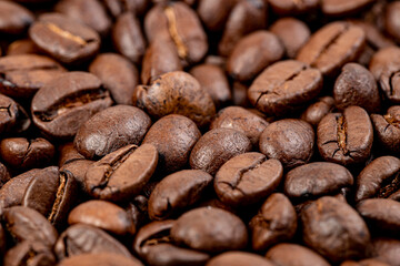 Roasted coffee beans, can be used as background close-up. Fragrant Arabica coffee.