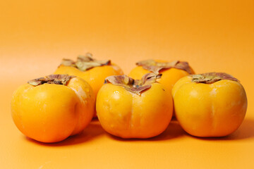 top view of persimmon on white background 