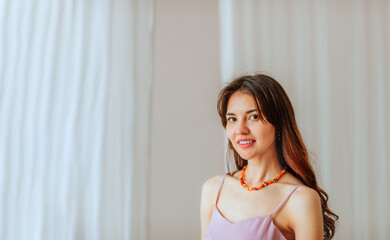 Beautiful long haired young woman on white background with copy space.