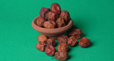 Indian jujube or ber or berry grown in the wild or jungle. Closeup of India fruit on beautiful background.