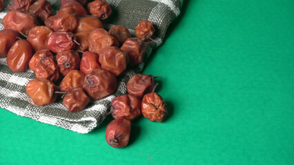 Indian jujube or ber or berry grown in the wild or jungle. Closeup of India fruit on beautiful...