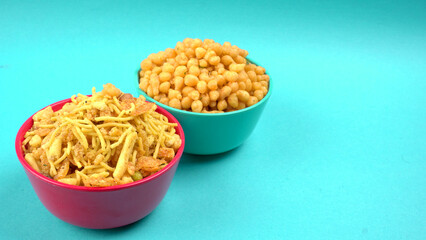 Indian Snacks, Traditional Indian deep fried salty dish called chivda or mixture or farsan made of gram flour and mixed with dry fruits and roasted nuts with salt, pepper, pulses, spice and green peas