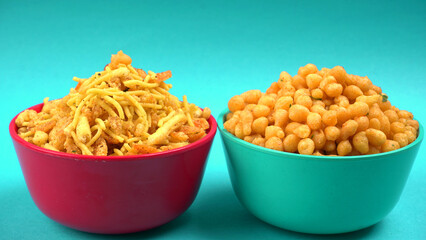 Indian Snacks, Traditional Indian deep fried salty dish called chivda or mixture or farsan made of gram flour and mixed with dry fruits and roasted nuts with salt, pepper, pulses, spice and green peas