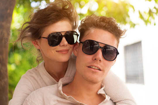 Happy cheerful couple in sunglasses