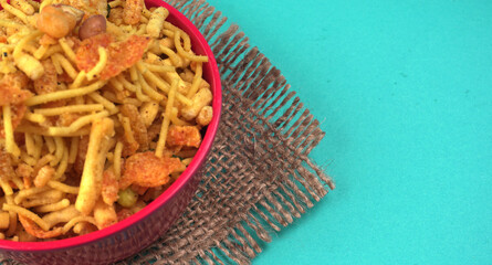 Indian Snacks, Traditional Indian deep fried salty dish called chivda or mixture or farsan made of gram flour and mixed with dry fruits and roasted nuts with salt, pepper, pulses, spice and green peas