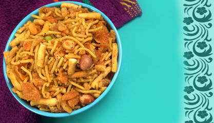 Indian Snacks, Traditional Indian deep fried salty dish called chivda or mixture or farsan made of gram flour and mixed with dry fruits and roasted nuts with salt, pepper, pulses, spice and green peas