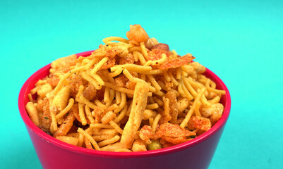 Indian Snacks, Traditional Indian deep fried salty dish called chivda or mixture or farsan made of gram flour and mixed with dry fruits and roasted nuts with salt, pepper, pulses, spice and green peas