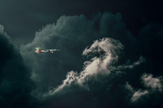 Commercial plane flying through clouds