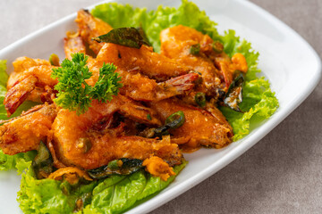 udang saus telur asin or Salted egg fried shrimp with curry leaves