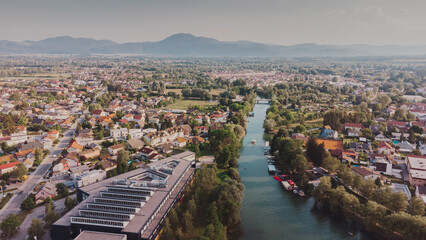 Fototapeta na wymiar Aerial view of the river Ljubljanica, Ljubljana Slovenia. Summer landscape. Travel in Europe drone photo.