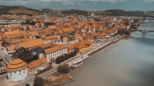 Maribor, Slovenia Drava river on a sunny day. Bright sunny day, Travel in Europe. An aerial view drone photo.