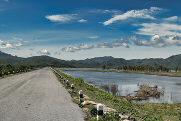 Road along one of the many reservoirs in the mountainous province of Lampang, Thailand, not far from the town of Li.
