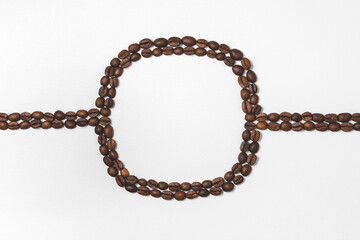 Flat lay composition of coffee beans with square inside and horizontal line. Frame style concept for inscriptions. Top view with copy space on gray texture background.