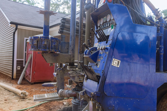 On Private Plot Of Land, A Portable Hydraulic Water Well Drilling Rig With Water Extraction