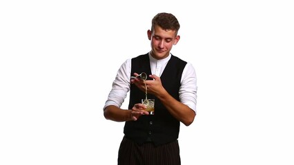 Profession bartender. Process novice bartender pours alcohol. Intern, cheerful young guy