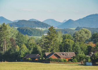 View of the village and the Alps from the window of a high-speed train