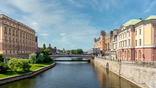 Norrstrom River, with Utrikesdepartementet, or Ministry for Foreign Affairs on the right, and Riksdagshuset, the Swedish Parliament House on the left, Gamla Stan, or Old town, Stockholm, Sweden
