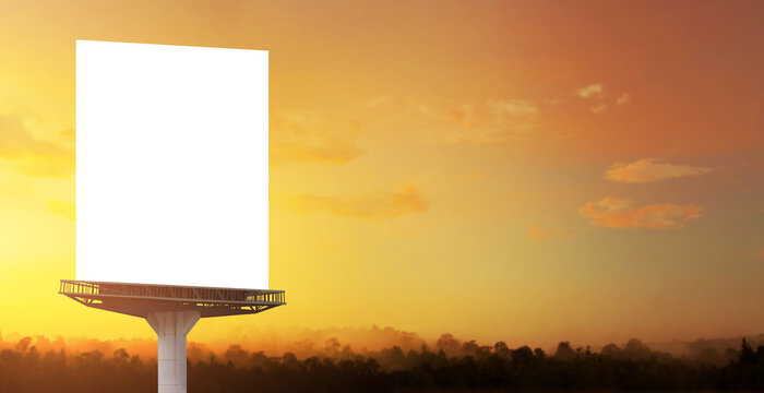 Portrait billboard white blank for outdoor advertising at sunset sky.