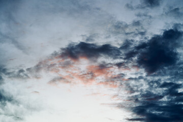 Obraz premium Blue sky with orange and white clouds. Teal and orange dreamy color cloudscape background.