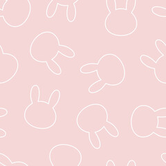 Seamless pattern from silhouettes of heads of rabbits. On a pink isolated background. Kawaii style.