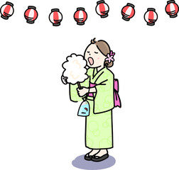 なつまつりでわたあめをほおばる女の子