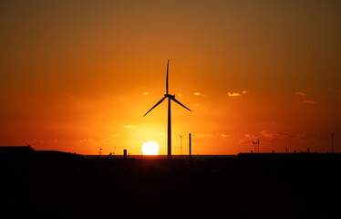 wind turbines at sunset