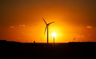 wind turbines at sunset