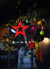 Very beautiful and bright shop windows are decorated for the New Year holidays - stars, balls, garlands.