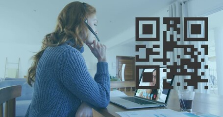 Animation of qr code over caucasian woman having video call on laptop - Powered by Adobe