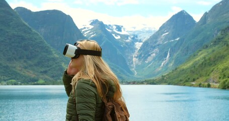 Exploring metaverse on VR for travel adventure with mountain, lake and sky view in 3D ai world. Traveling woman with virtual reality glasses to play and interact for a futurist gaming experience