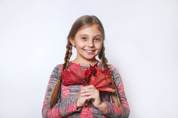 Smilng kid holding autumn maple leaves on white background. Autumn shopping. Seasonal sale.