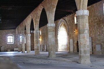 Fototapeta na wymiar Arches supporting the ceiling in the Palace of the Grand Master of the Knights of Rhodes, on the island of Rhodes, Greece