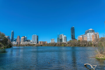 Fototapeta na wymiar View of low-rise to high-rise buildings across the Colorado River at Austin, Texas
